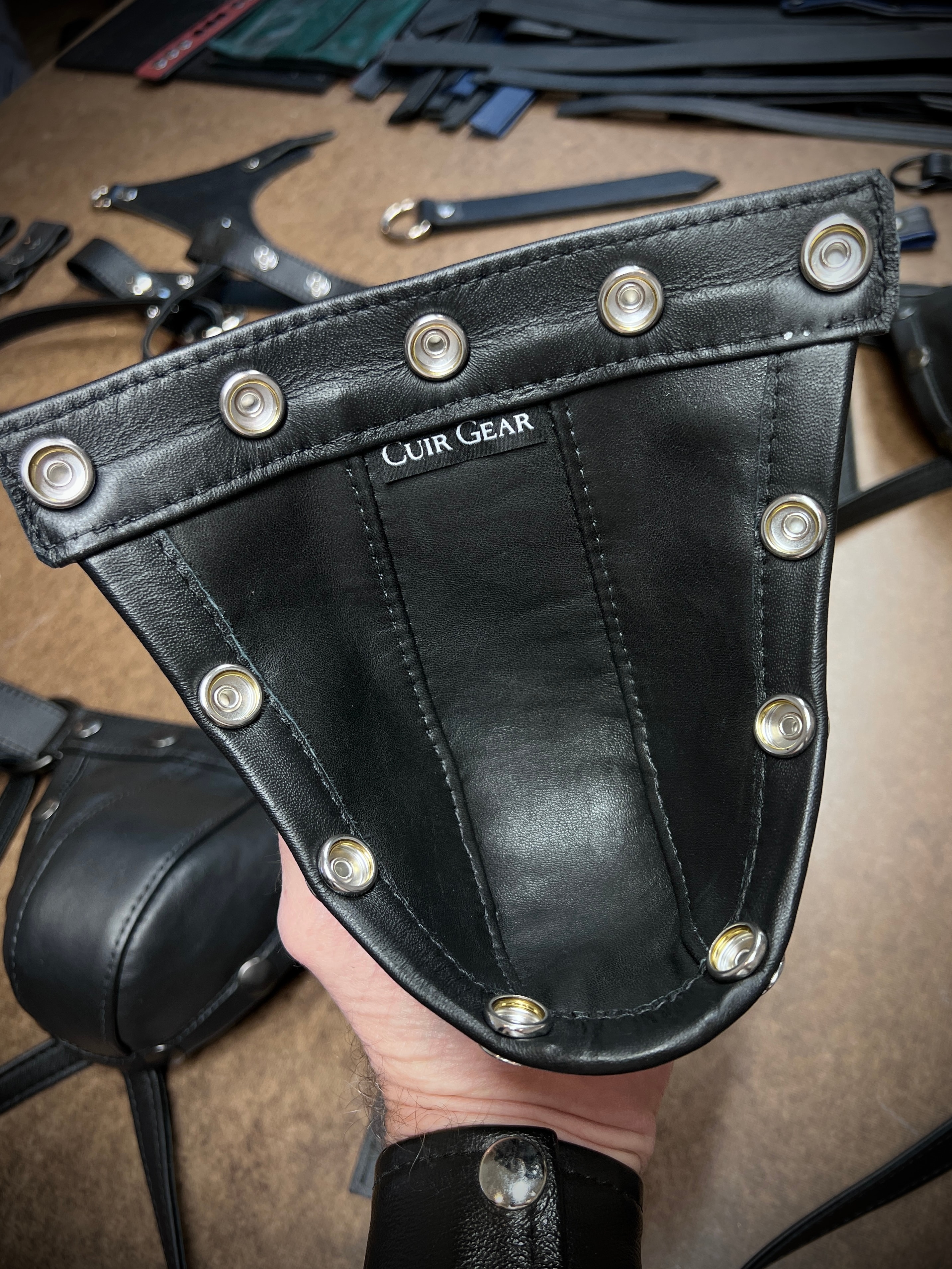 Black leather jockstrap pouch with Cuir Gear branding